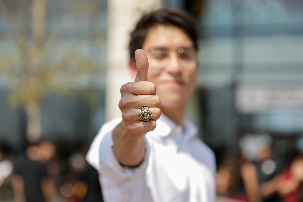A student showing off their new Aggie Ring on Ring Day
