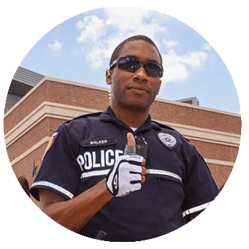 Police Officer giving a Gig Em Hand Sign